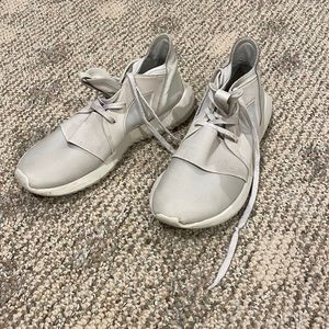 Beige colored adidas tubular sneakers